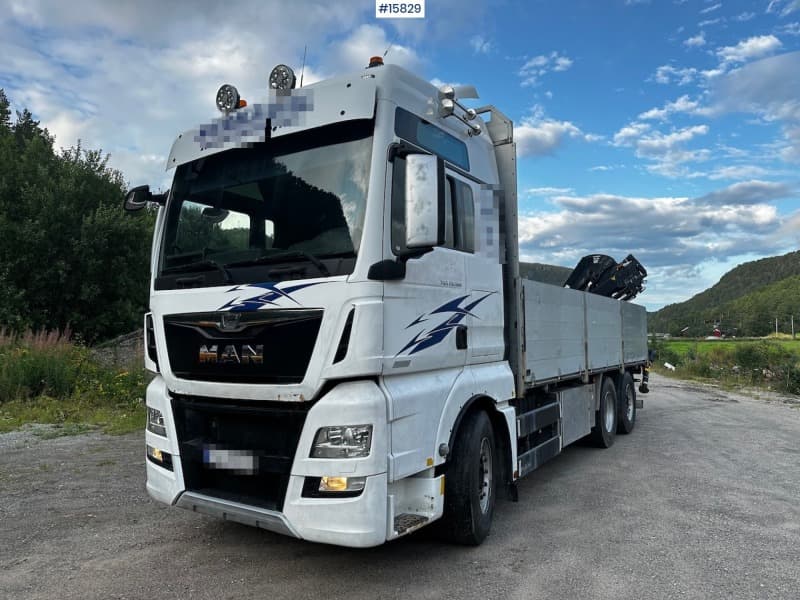 2015 MAN TGX 26.560 Flatbed truck with Hiab 138 crane from 2018. Rear mounted.