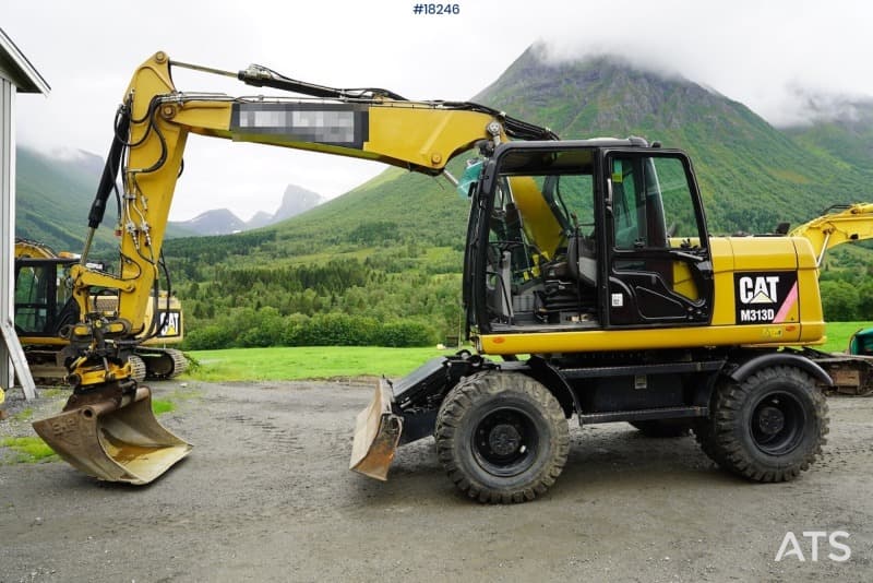 2011 Cat 313D wheeled machine with tilt and bucket